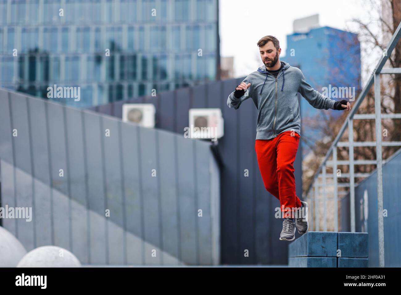 Man practicing parkour in the city Stock Photo