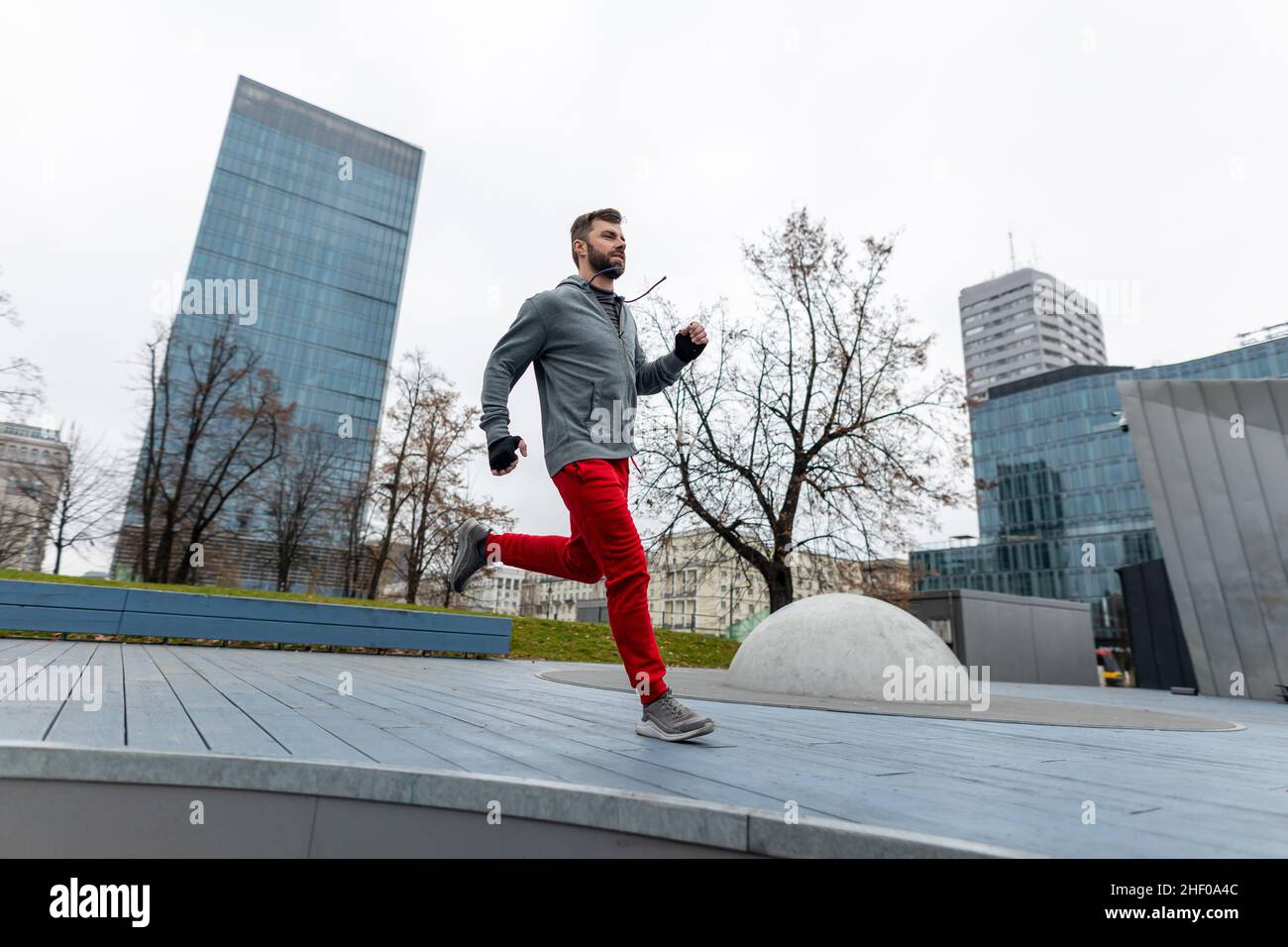 Young man running in the city Stock Photo
