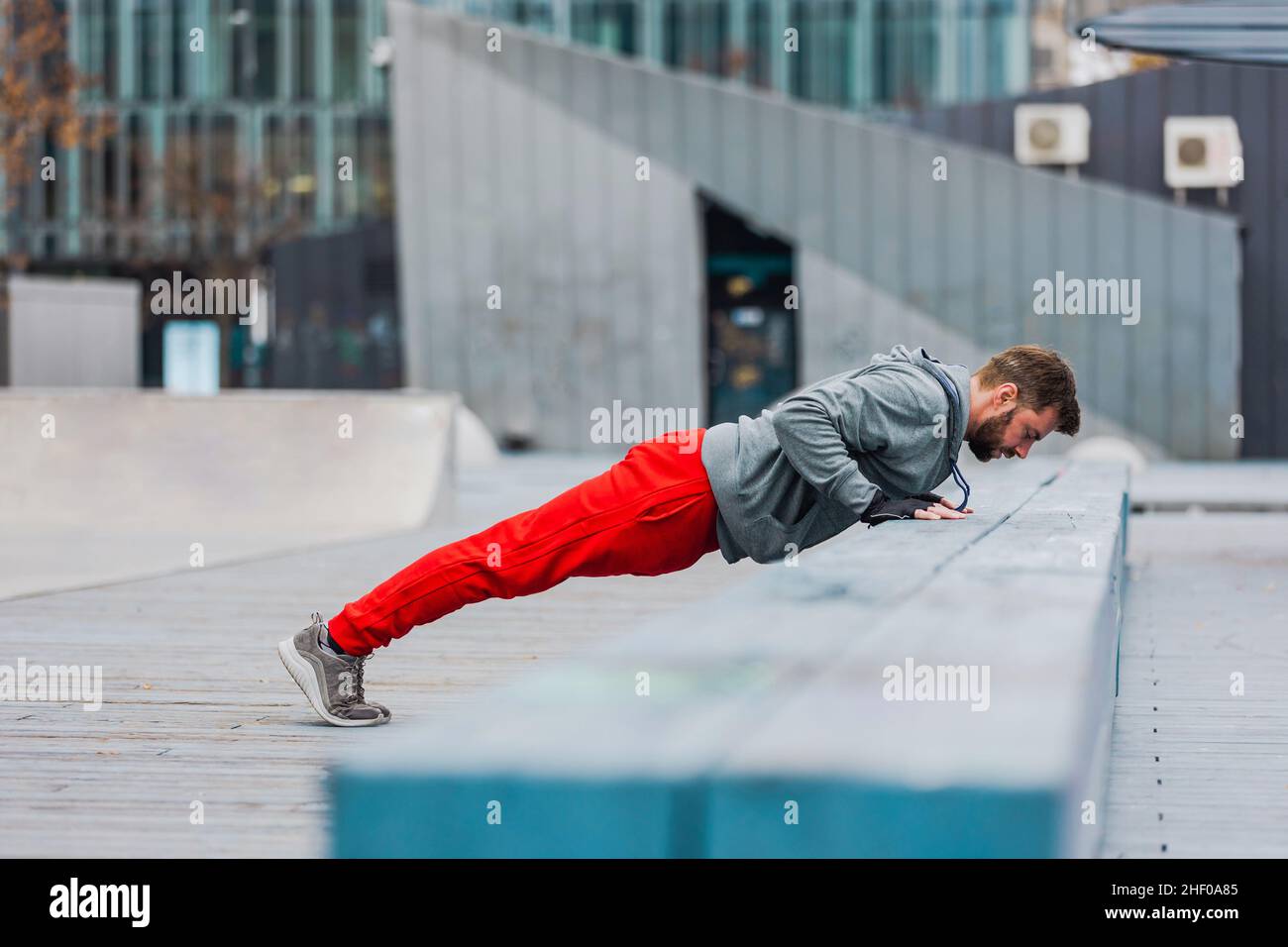 Young man exercising in urban setting Stock Photo