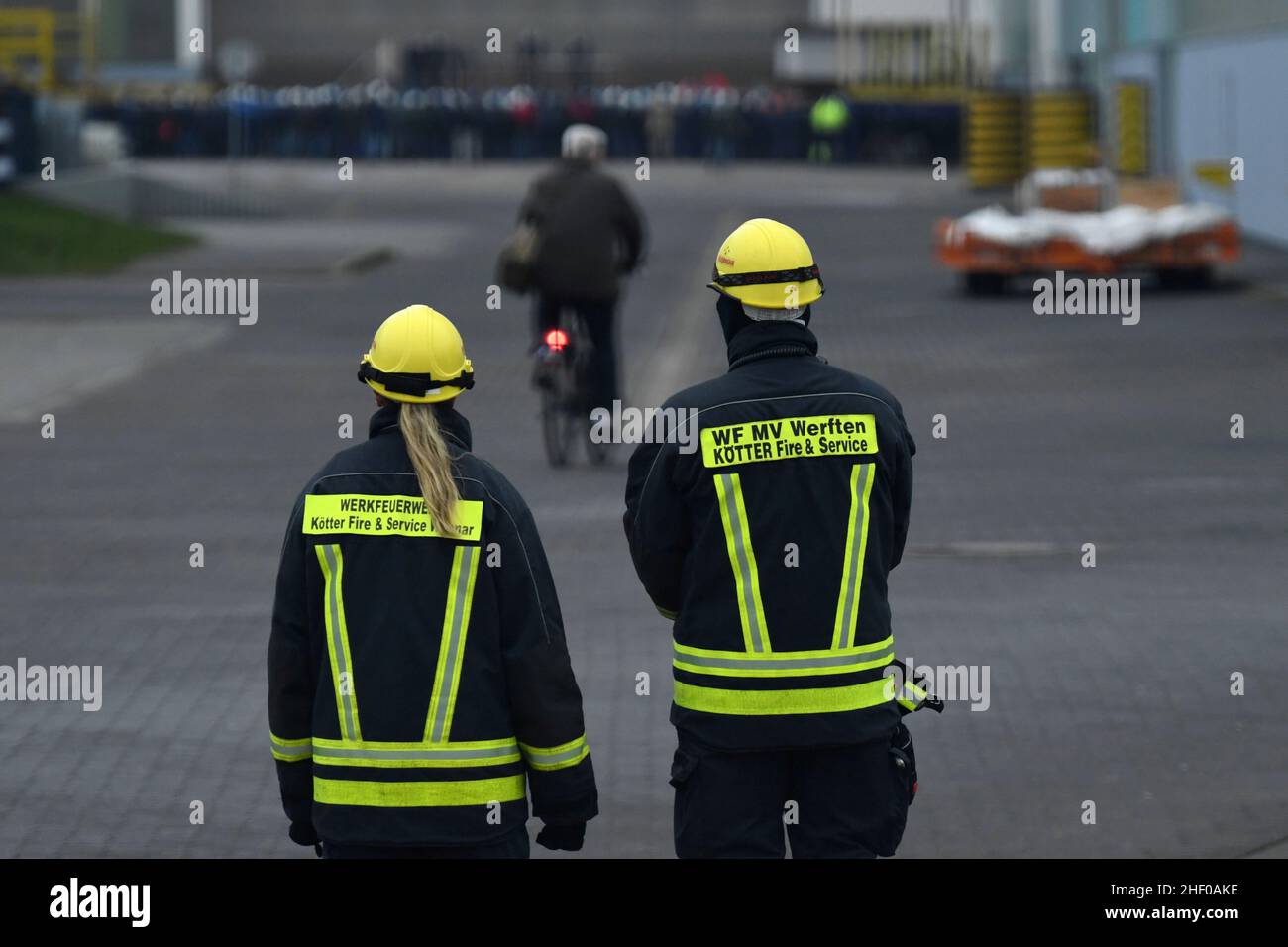 Workers stand before a news conference at MV Werften shipyards, which are insolvent, at their Wismar location, Germany January 13, 2022. REUTERS/Annegret Hilse Stock Photo