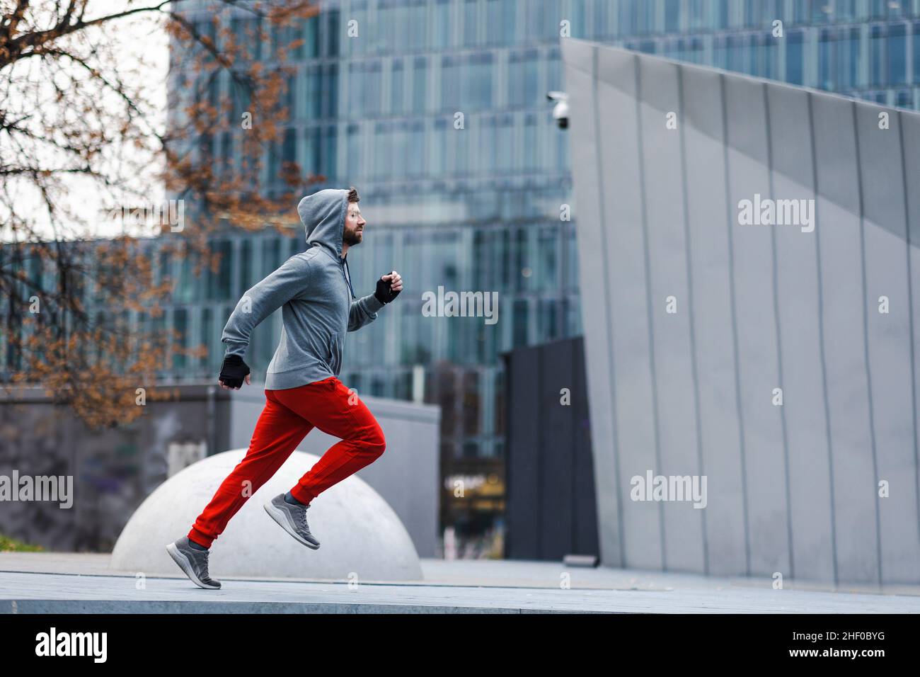 Young man running in the city Stock Photo
