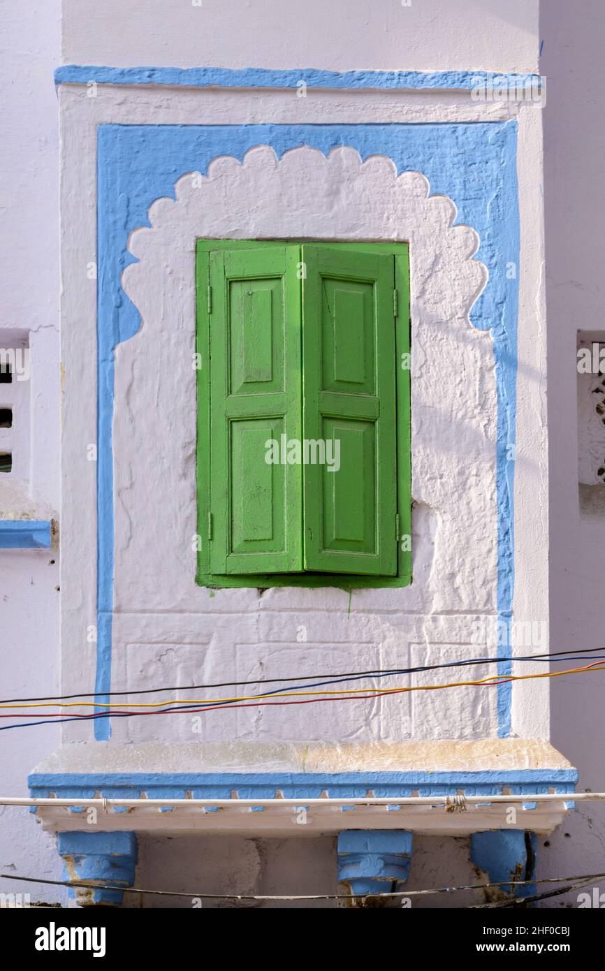 Decorative painted window with green shutters on a house in Udaipur, Rajasthan, India, South Asia Stock Photo