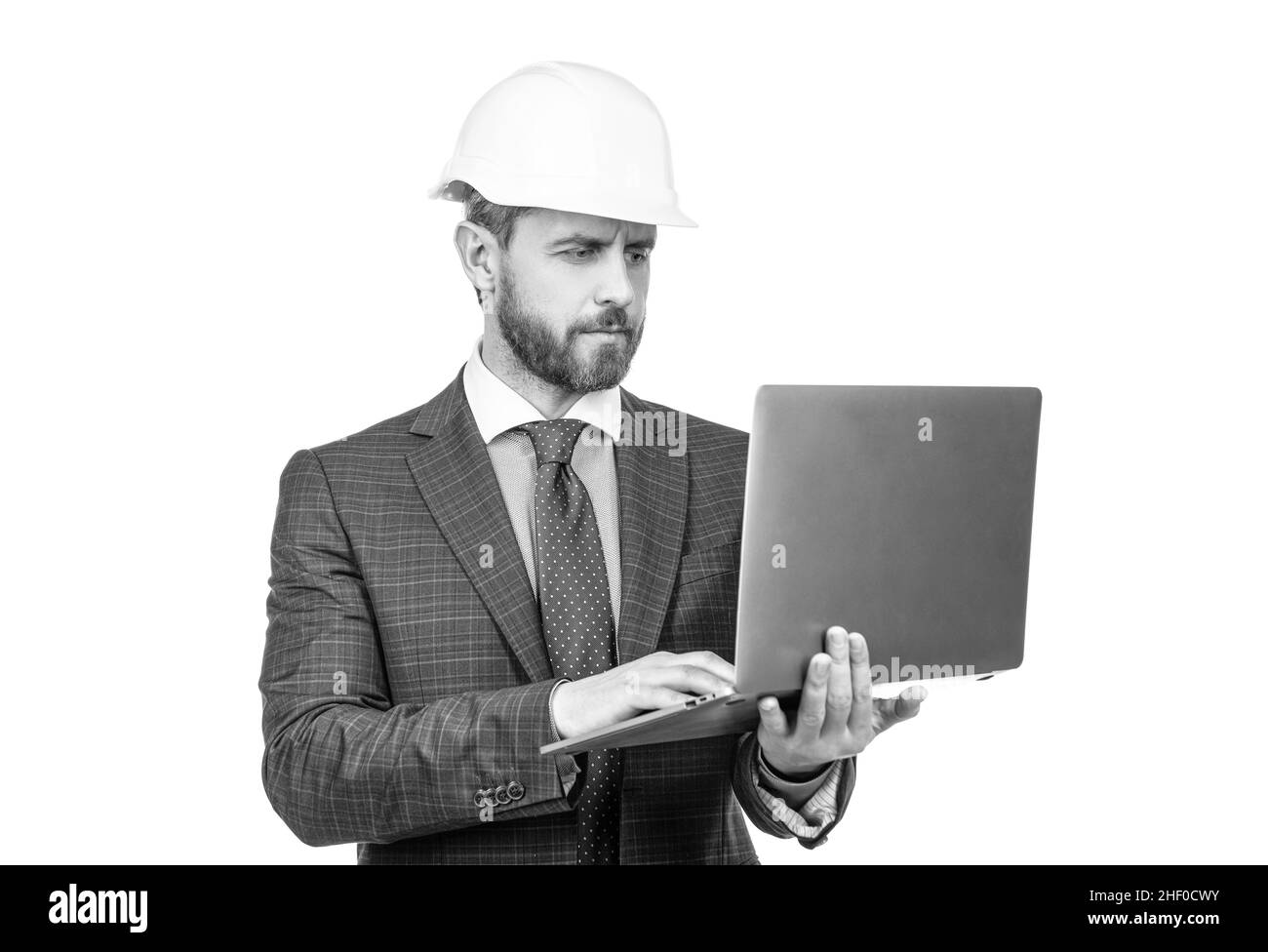 architect planning work. chief engineer in hardhat use computer. mature ceo checking email. Stock Photo