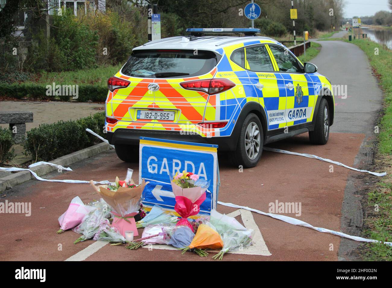 Flowers and messages left near to the scene in Tullamore, Co Offaly after a young woman, who has been named locally as Ashling Murphy, was killed on Wednesday evening. She died after being attacked while she was jogging along the canal bank at Cappincur at around 4pm on Wednesday. Issue date: Thursday January 13, 2022. Stock Photo