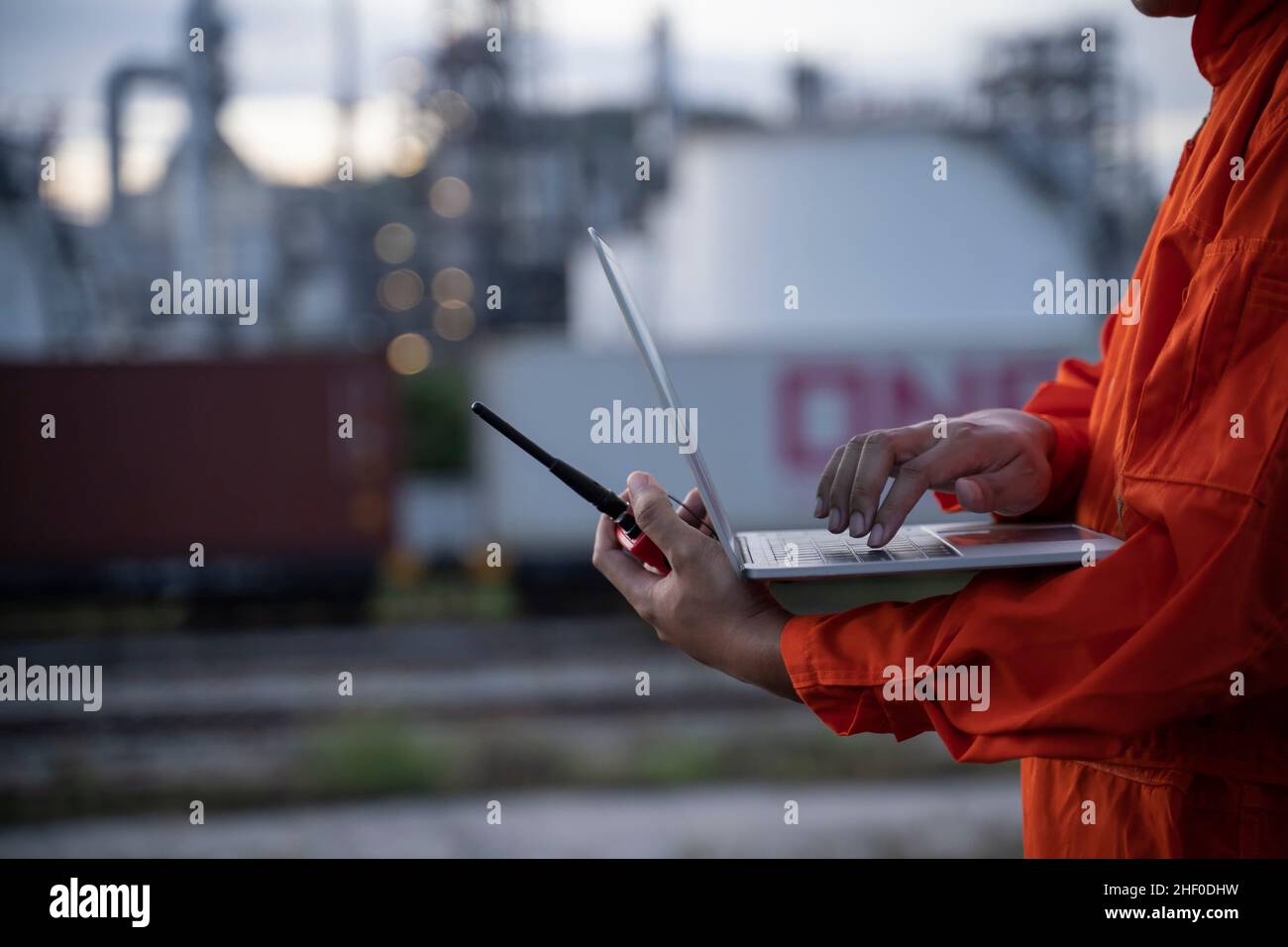 Petrochemical engineers work heavily with radio and laptop in the oil