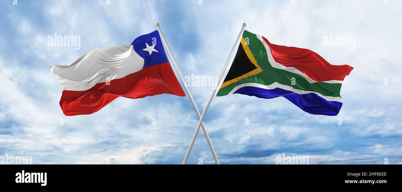 crossed national flags of Chile and South Africa flag waving in wind at ...