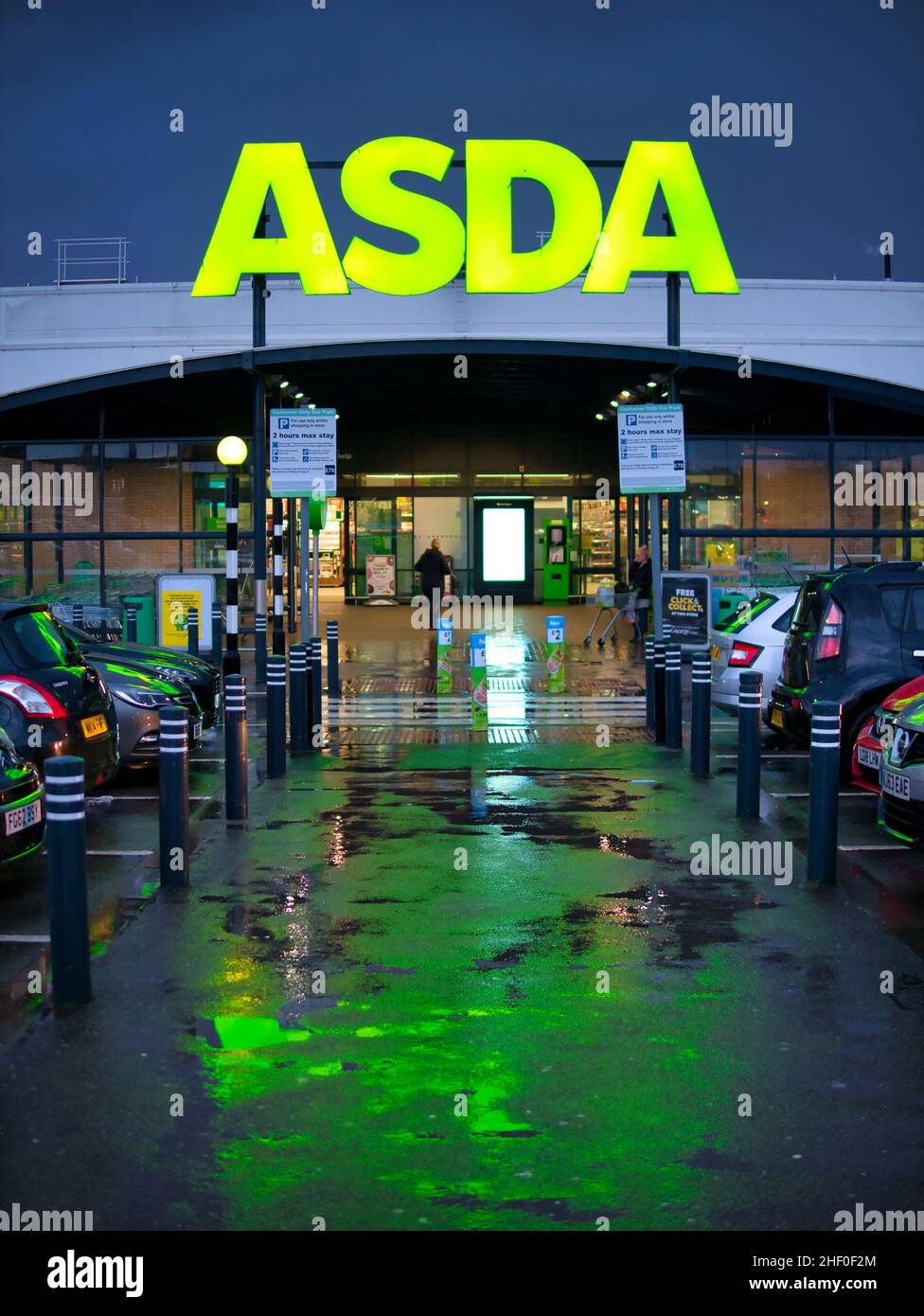 The car park and frontage of the a store of the ASDA British supermarket chain, located in a residential area in the North of England. Stock Photo