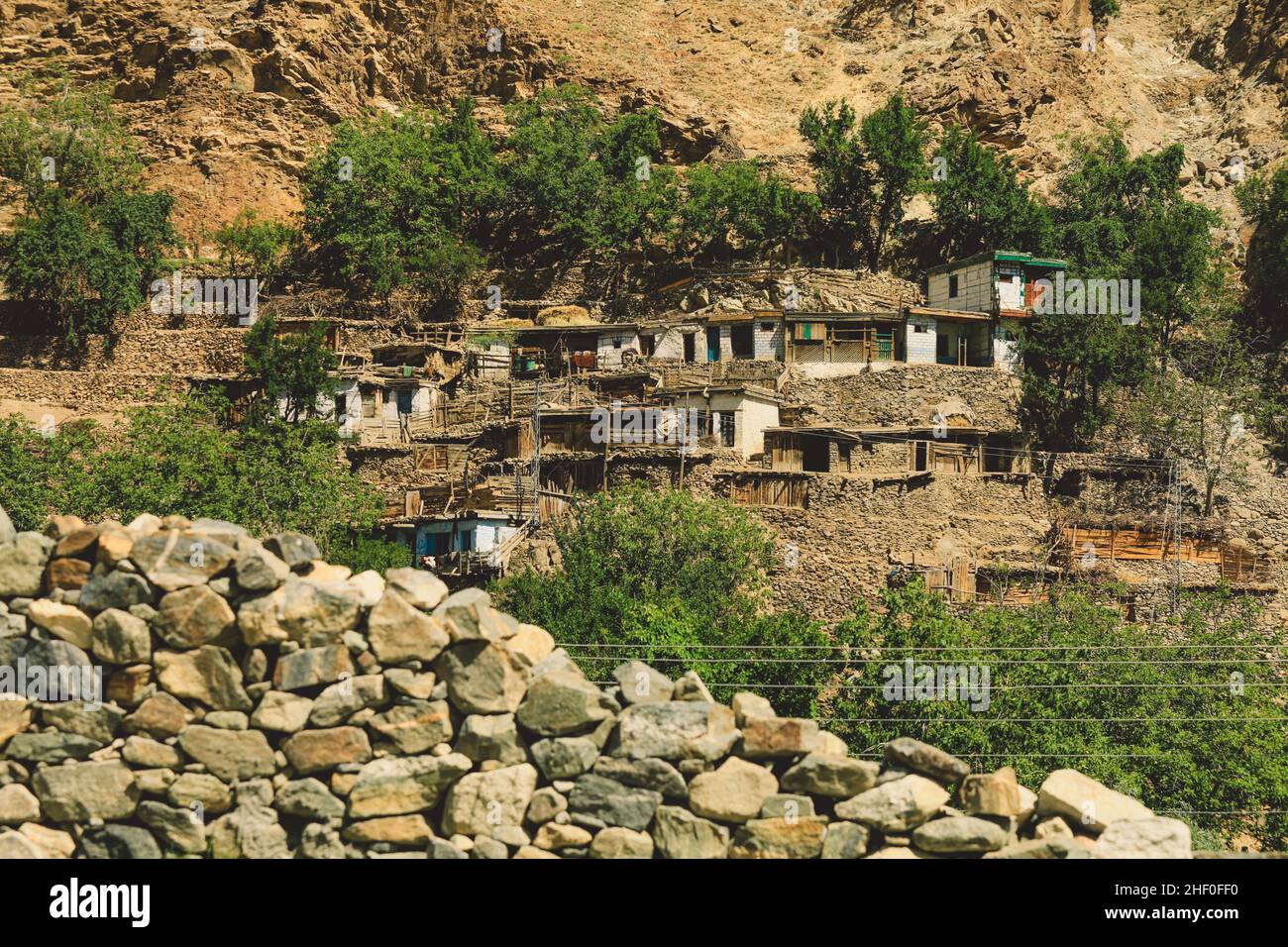 Traditional Houses on the Green Forest Rocks in Pakistani Mountains