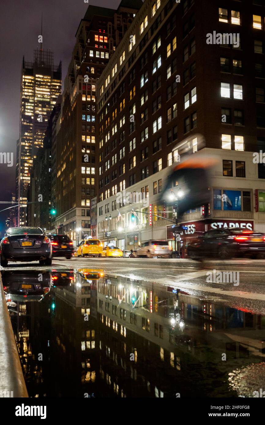 NYC, New York - February 23, 2018 : Nighttime activity on the streets of Manhattan that never sleeps in NYC, New York Stock Photo