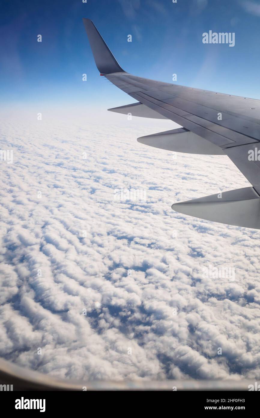 Flight over an ocean of cottony clouds towards NYC, New York Stock Photo