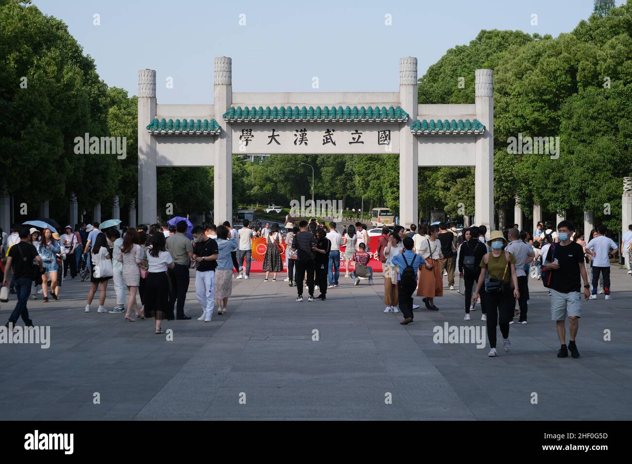 facade of Wuhan University campus gate. With students and tourists. Famous key university and travel destination in Wuhan, Hubei province Stock Photo