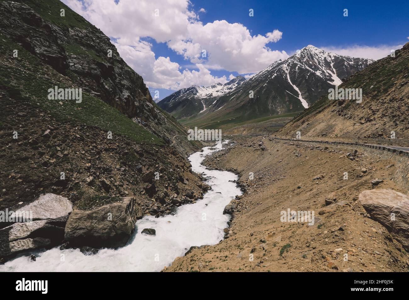 Mountain River in Gilgit Baltistan Highlands under the Blue and Cloudy Sky, Pakistan Stock Photo