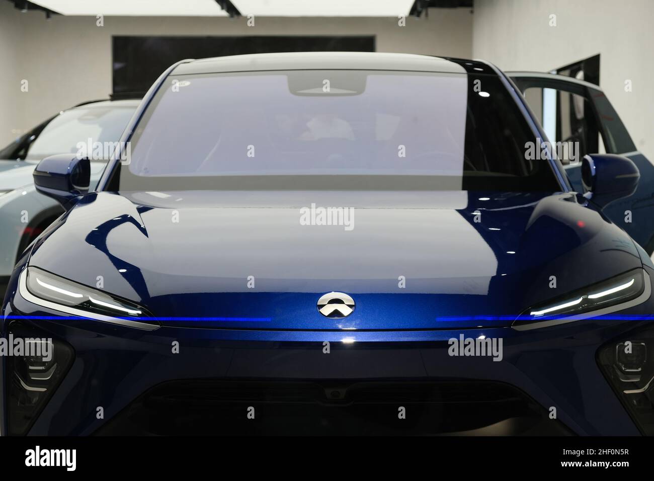 close up NIO logo in the front of electric car. NIO is A Chinese electric vehicle manufacturer