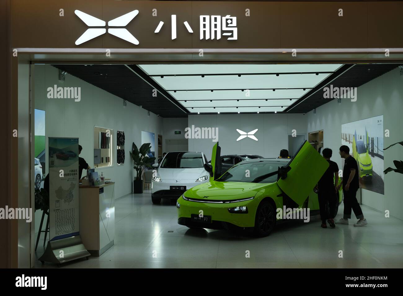 Xpeng electric car store with customers inside. Xpeng Motors is a Chinese electric car brand. Stock Photo