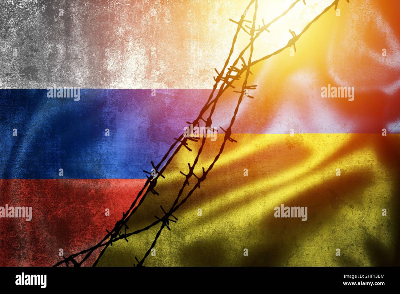 Grunge flags of Russian Federation and Ukraine divided by barb wire illustration, concept of tense relations between Ukraine and Russia Stock Photo