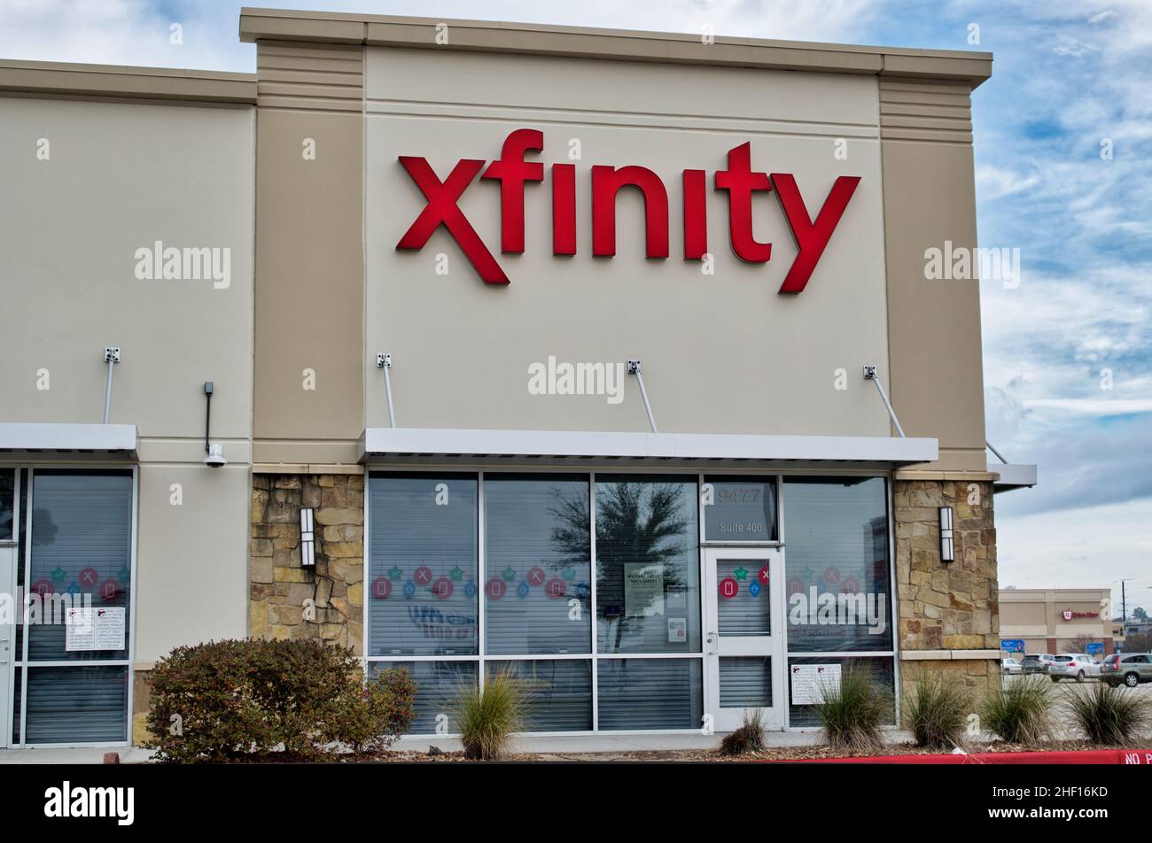 Houston, Texas USA 12-03-2021: Comcast Xfinity business exterior in Houston, TX. Telecommunications business established in 1981. Stock Photo