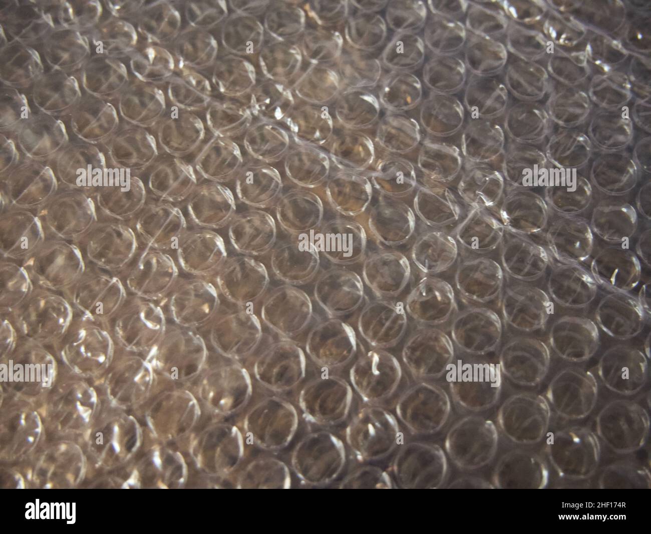 Bubble wrap is a pliable transparent plastic material used for packing