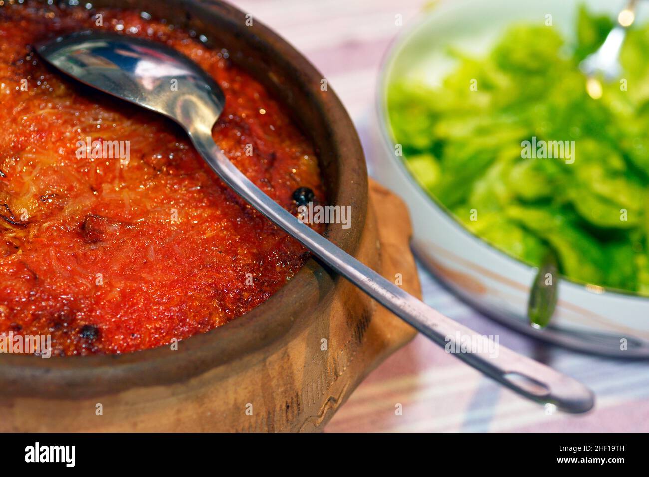 Minced meat in cabbage leaves, in a clay pot, close up photo Sarma Stock Photo