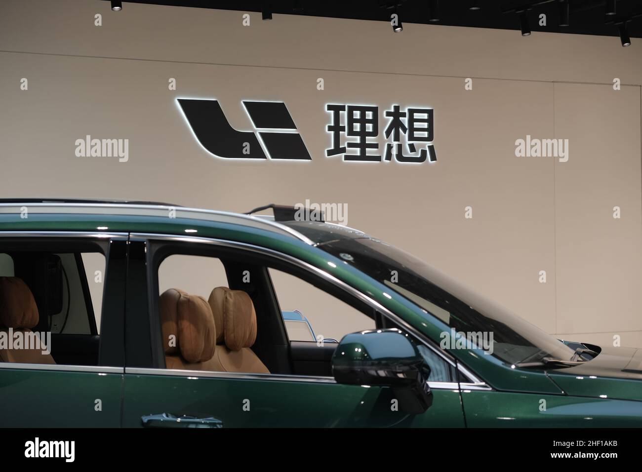 Li Auto(Li Xiang) brand logo and electric car in store. A Chinese EV(electric vehicle) company Stock Photo