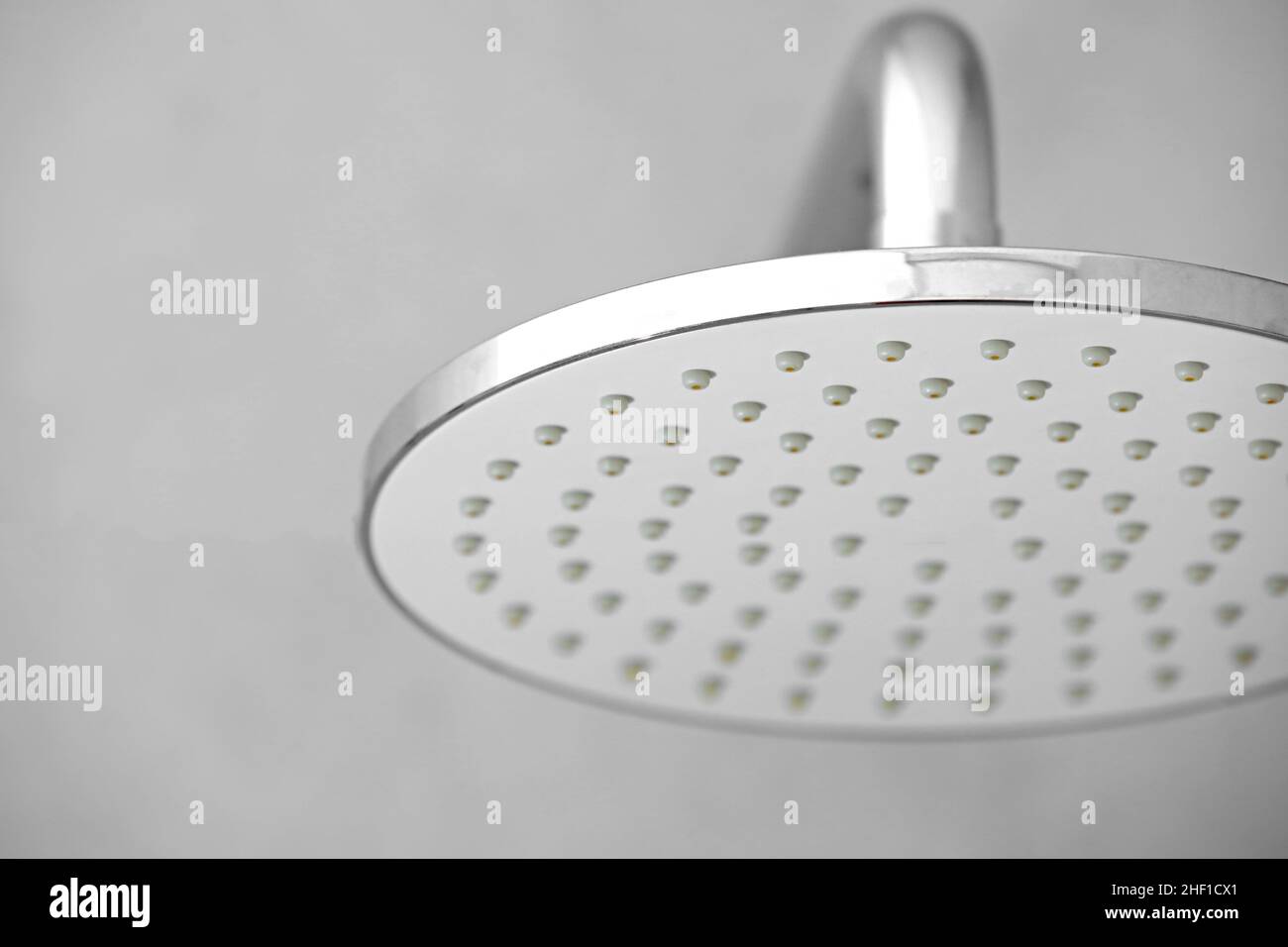 Dirty calcified shower mixer tap, faucet with limescale on it, plaque