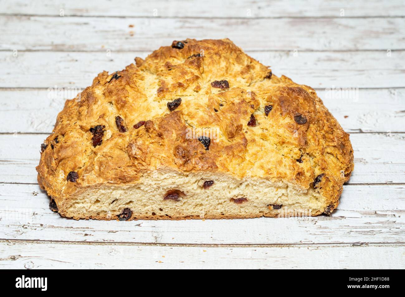 Soda bread is a variety of quick bread traditionally made in a variety of cuisines in which sodium bicarbonate (otherwise known as 'baking soda', or i Stock Photo