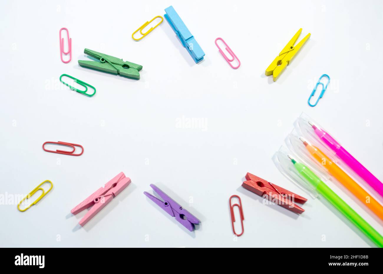Set of colorful paper clips with white copy space background. Business creativity concepts. Flat lay design, can be used for presentation slides. Stock Photo