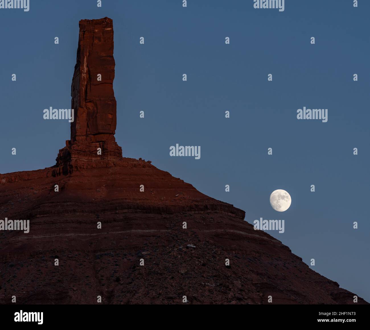 The moon rising behind Castleton Tower in Utah Stock Photo Alamy