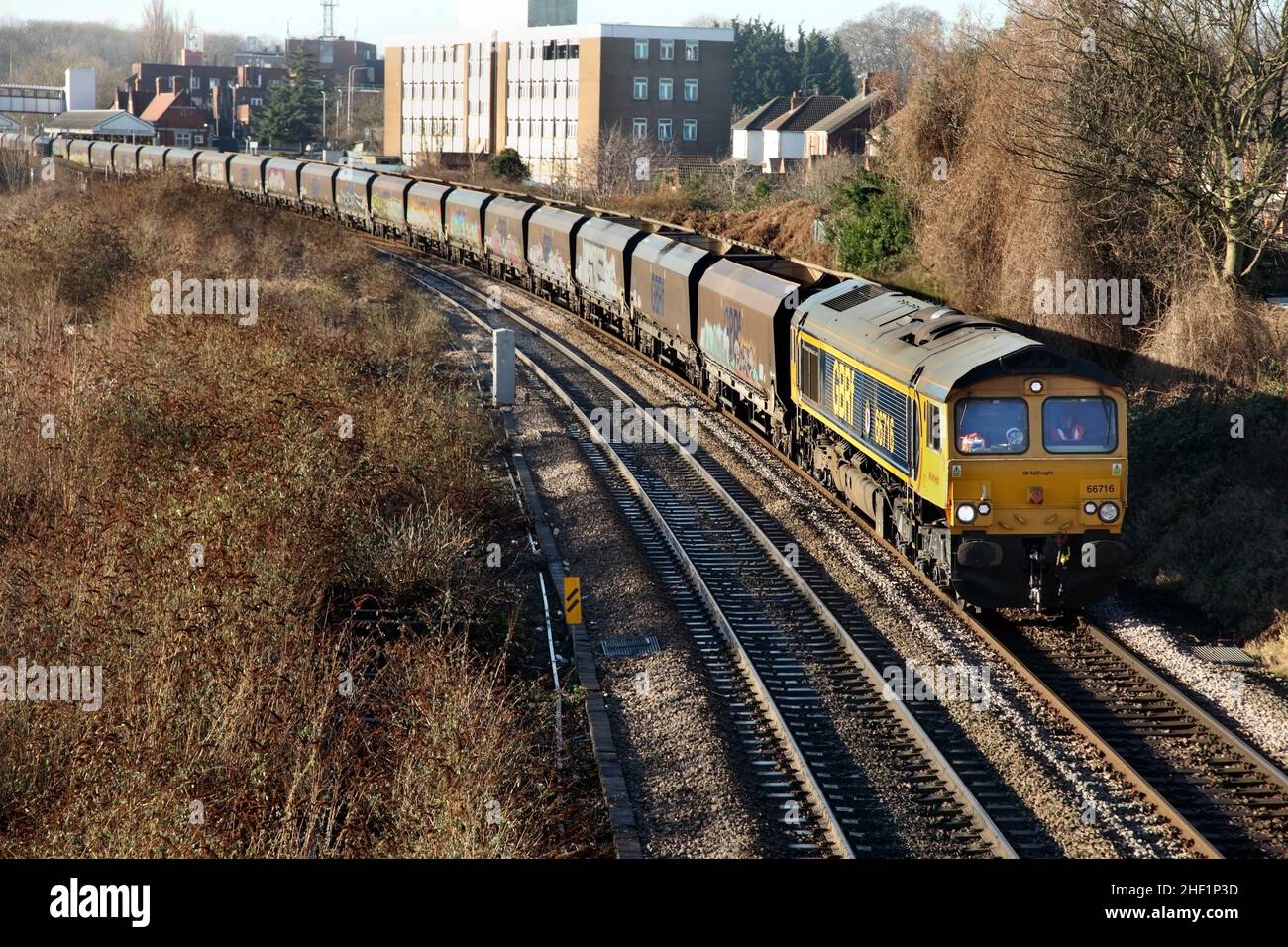 GB Railfreight Class 66 loco 66716 hauls the 4R79 1005 Doncaster to Immingham empty wagon service through Scunthorpe on 13/01/22. Stock Photo