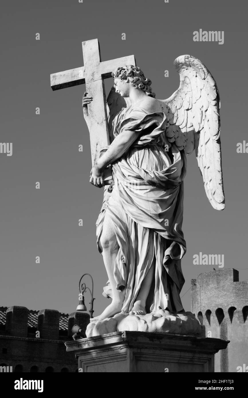 ROME, ITALY - SEPTEMBER 1, 2021: Statue of angel with the Cross in baroque style  from Angel's Bridge by Ercole Ferrata (1610 - 1686). Stock Photo
