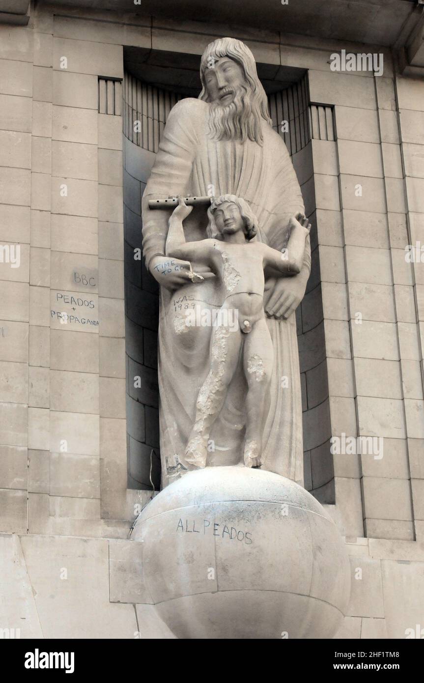 London, UK. 13th Jan, 2022. Man uses hammer to attack statue on front of BBC Broadcasting House