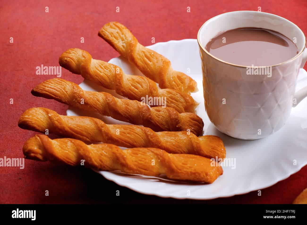 Indian khari or kharee or salty Puffy brown Snacks, served with indian hot tea, Indian Breakfast. Stock Photo