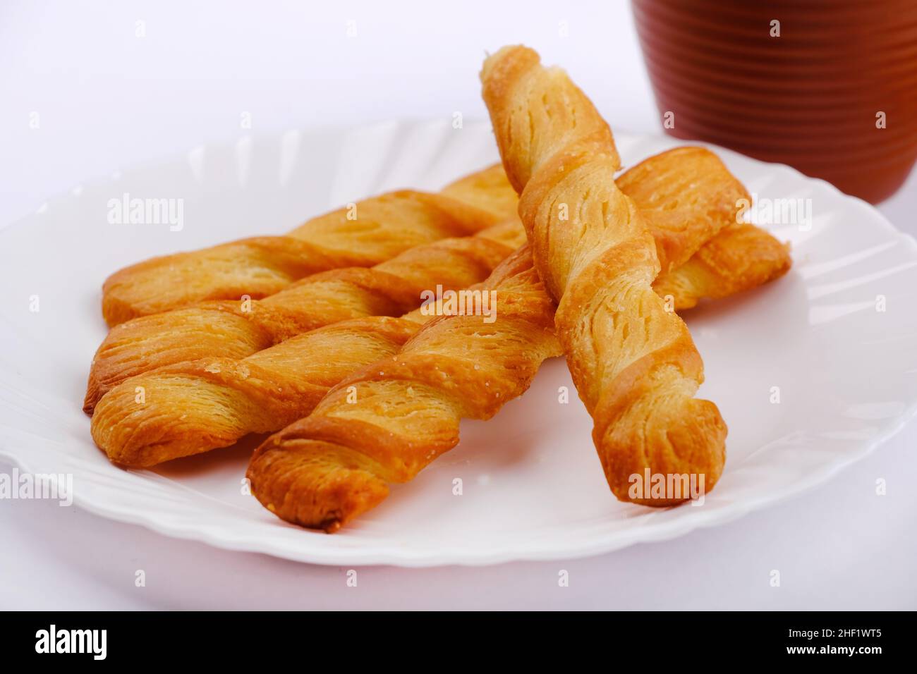 Indian khari or kharee or salty Puffy brown Snacks, served with indian hot tea, Indian Breakfast. Stock Photo