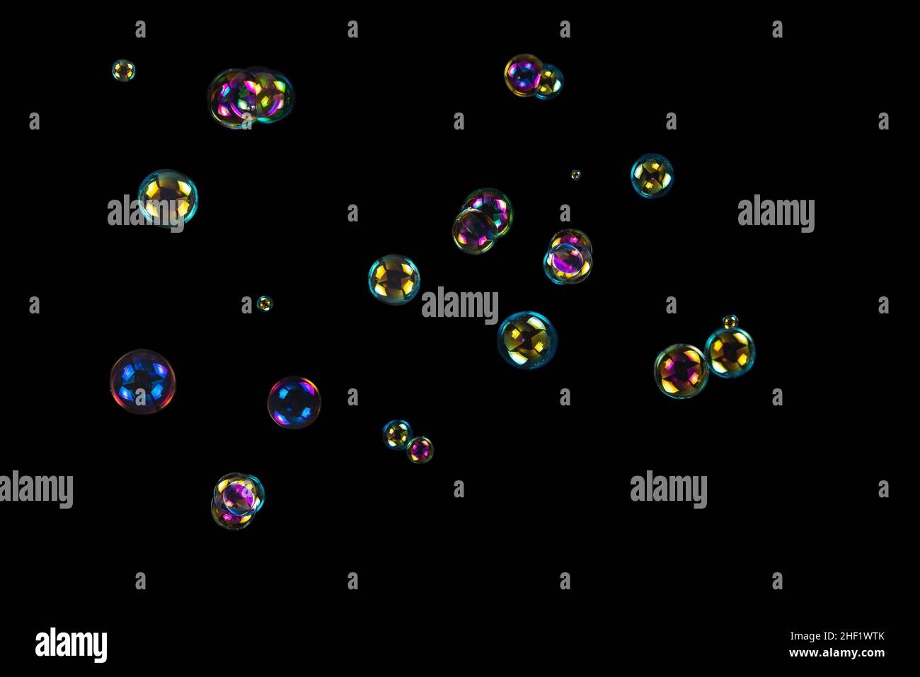 Soap bubbles isolated on a black background. Copy space Stock Photo - Alamy