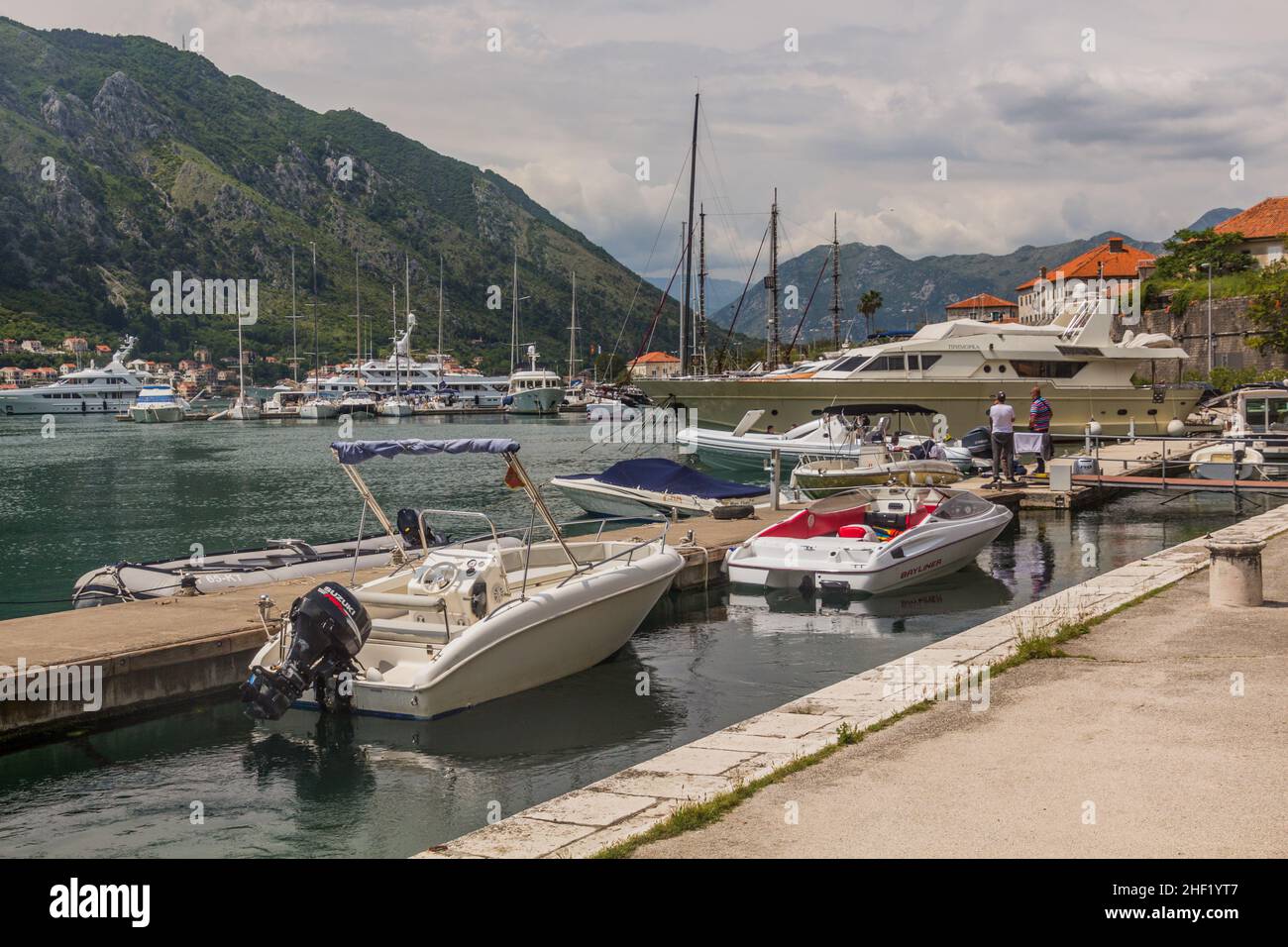 KOTOR, MONTENEGRO - JUNE 1, 2019: Boats in Kotor marina, Montenegro. Stock Photo