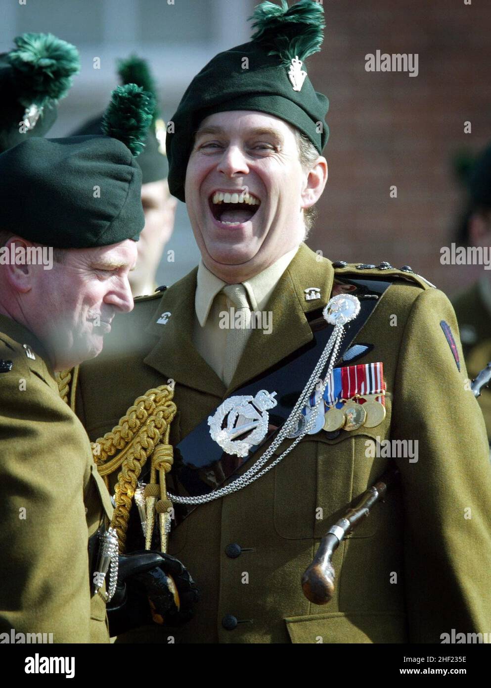 File photo dated 17/3/2003 of the Duke of York, who is Colonel in Chief of the Royal Irish Regiment, jokes with new recruits to the regiment, at a passing out parade at the Regiment's Headquarters in Ballymena, Northern Ireland. The Duke's military affiliations and royal patronages have been returned to the Queen, Buckingham Palace has announced. Issue date: Thursday January 13, 2022. Stock Photo