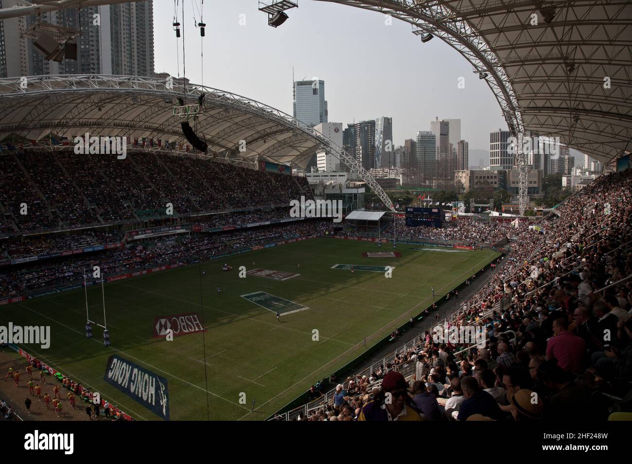 The crowd, at the Hong Kong Stadium, during the Hong Kong Sevens. It is considered the most important 7s rugby tournament in the world. Stock Photo