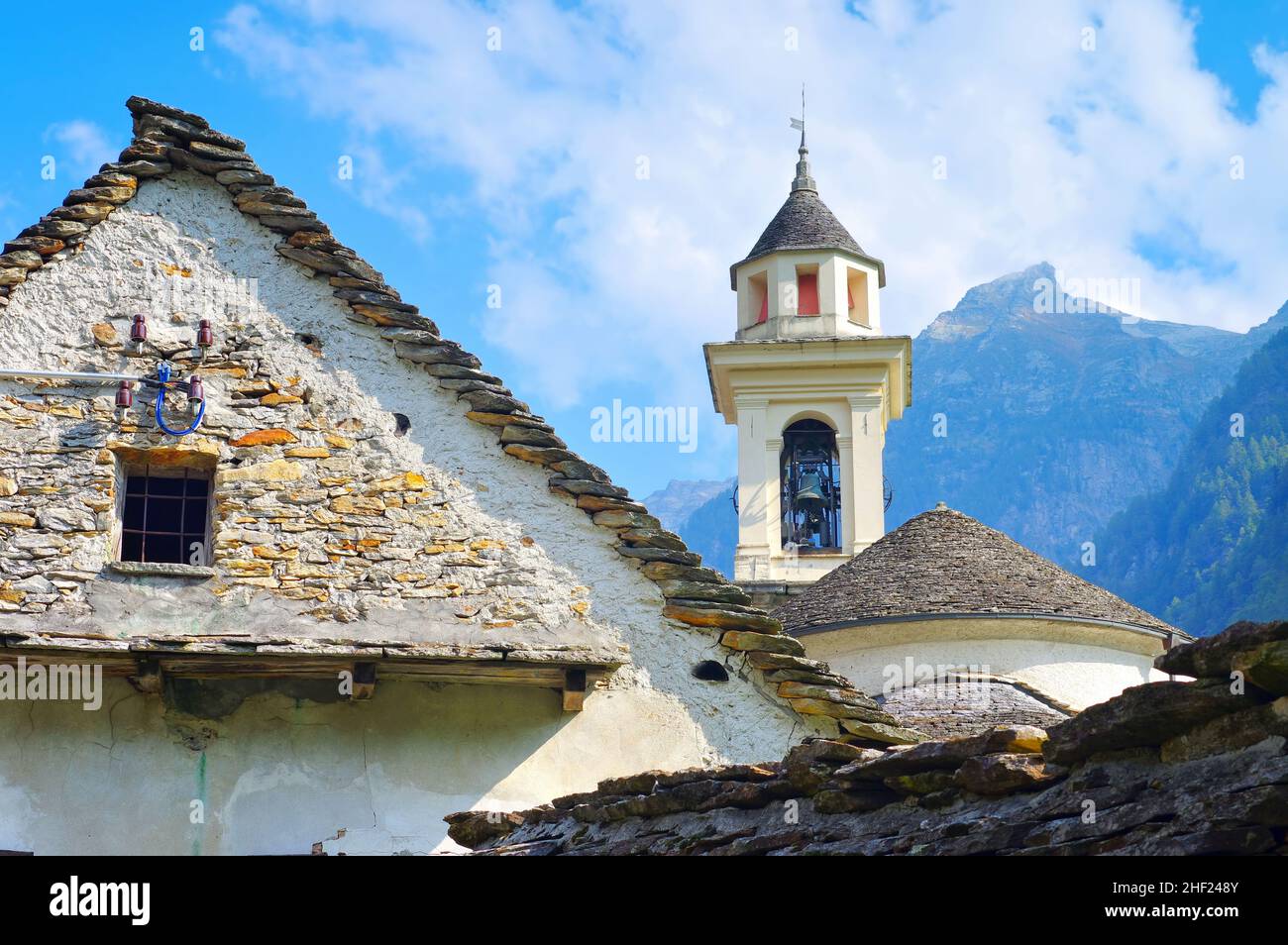 typical houses and church in Sonogno in the Verzasca Valley, Ticino in Switzerland, Europe Stock Photo