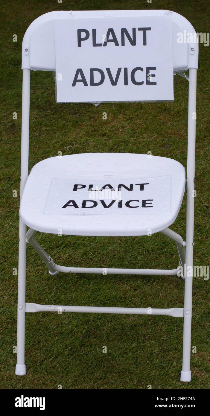 A seat by the plant advice stall.   RHS show at Hampton Court Stock Photo