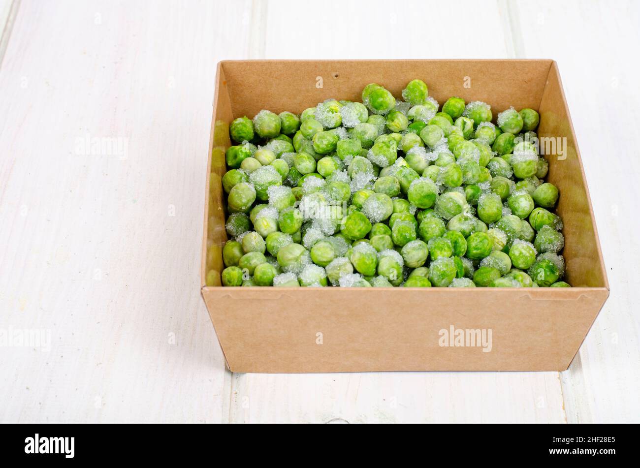 Frozen green peas, preservation of vitamins and vegetables. Photo Stock