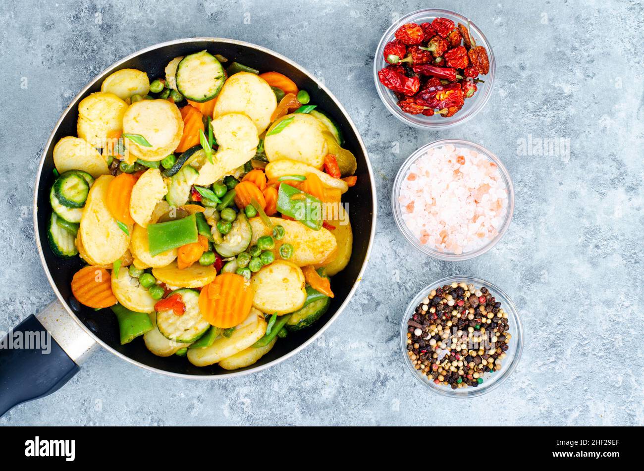 Mix of frozen organic vegetables fried in pan. Studio Photo Stock Photo