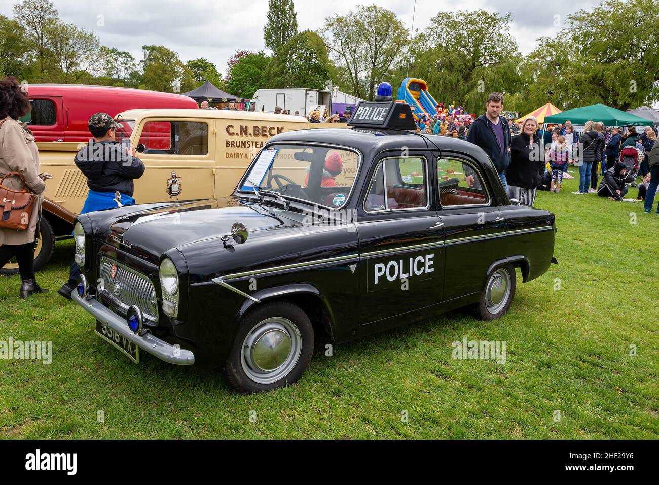 Culcheth Community Day, Cheshire, 2019 where stalls circled a collection of vintage vehicles restored by enthusiasts and viewed by the public Stock Photo