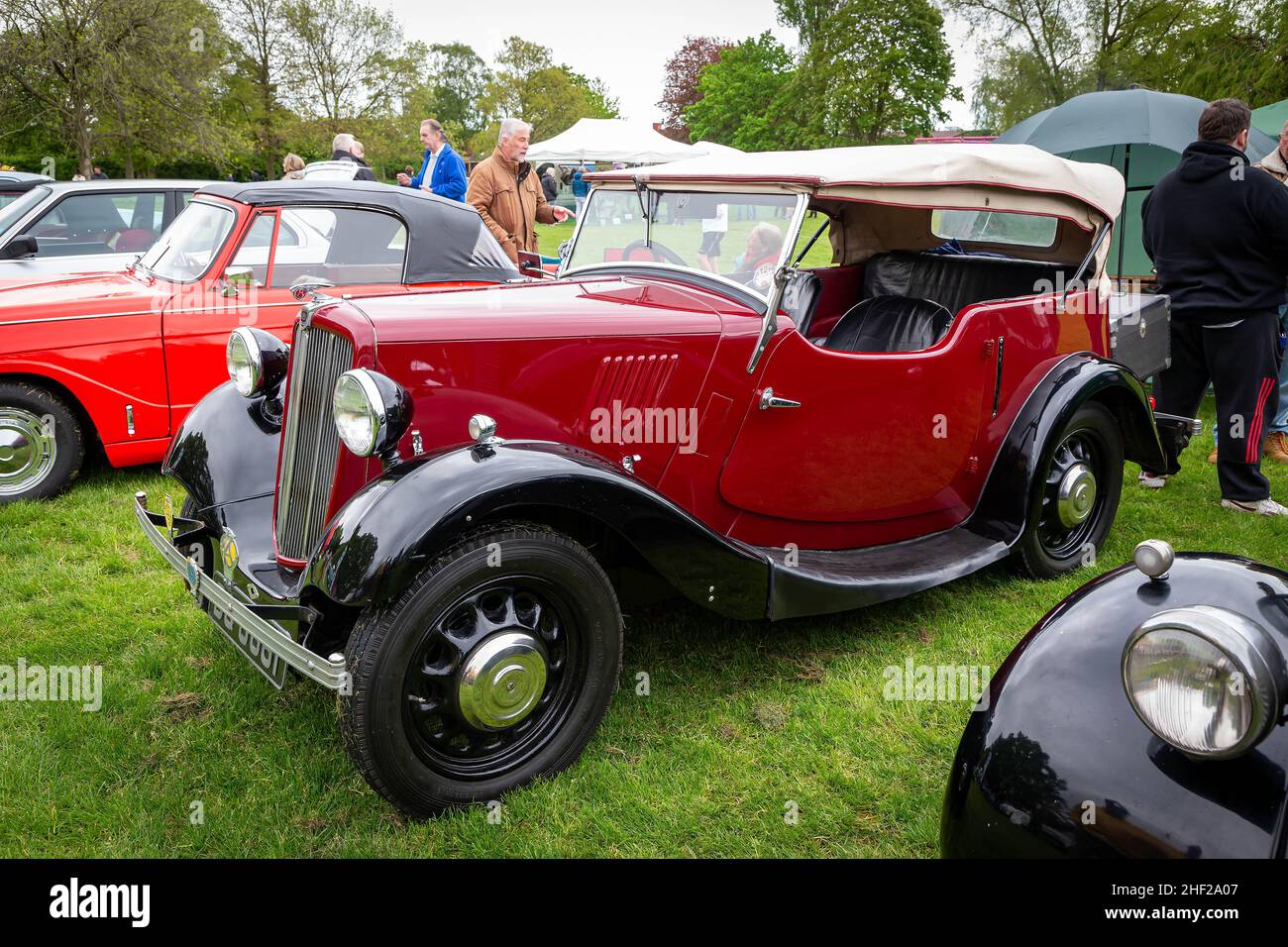 Culcheth Community Day, Cheshire, 2019 where stalls circled a collection of vintage vehicles restored by enthusiasts and viewed by the public Stock Photo