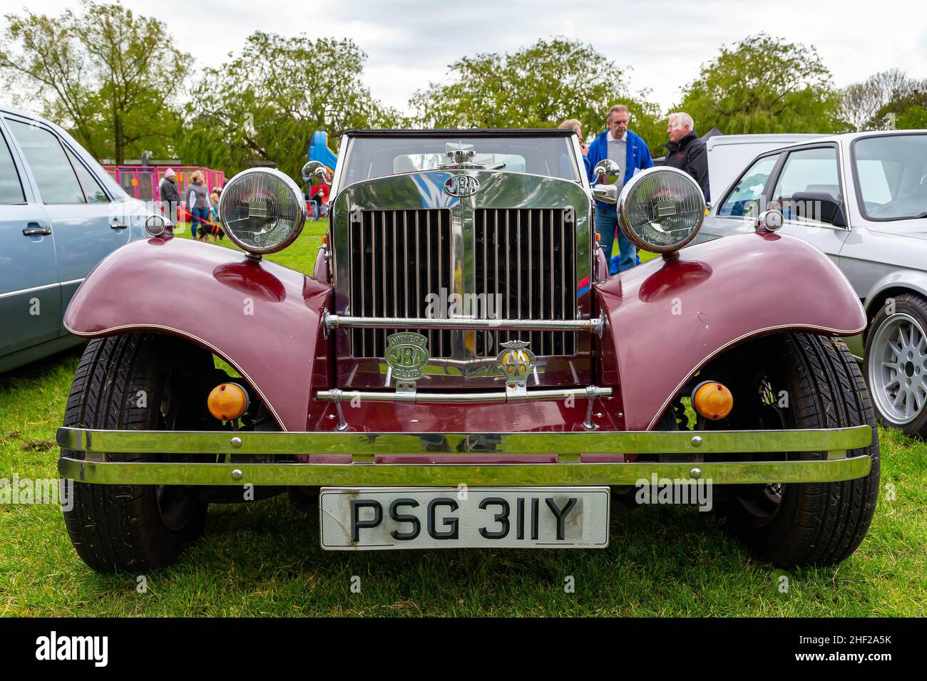 Culcheth Community Day, Cheshire, 2019 where stalls circled a collection of vintage vehicles restored by enthusiasts and viewed by the public Stock Photo