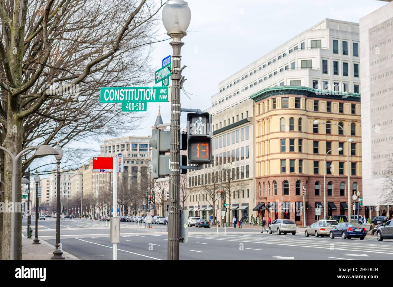 Traffic Lights in Constitution Avenue in Downtown Washington DC, VA, USA. Urban Street Photography. Buildings and Avenue in Background. Stock Photo