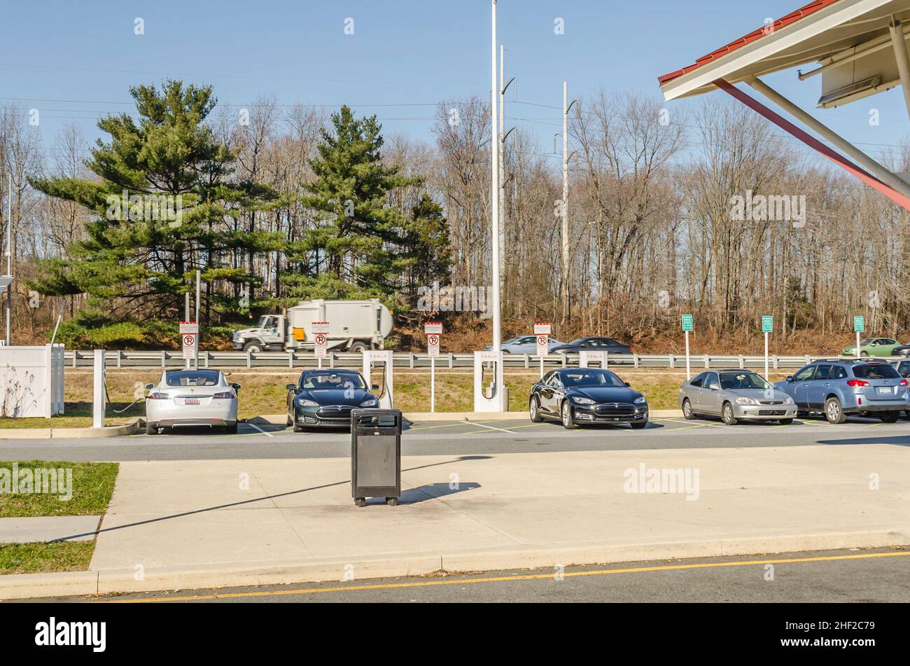 Electric Cars Charge their Batteries at a Highway Rest Area. Charging