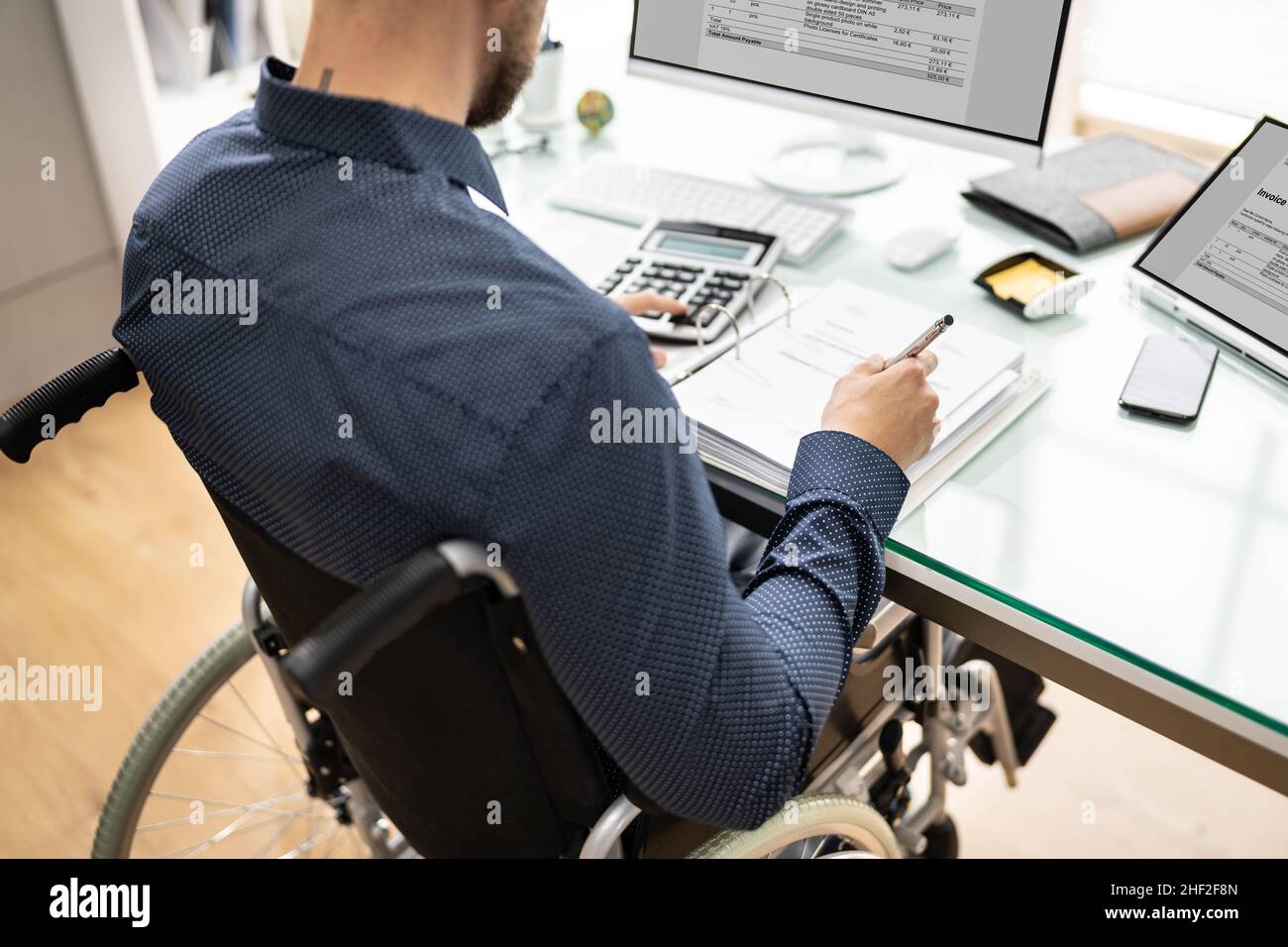 Accountant Using E Invoice Software At Computer In Office Stock Photo