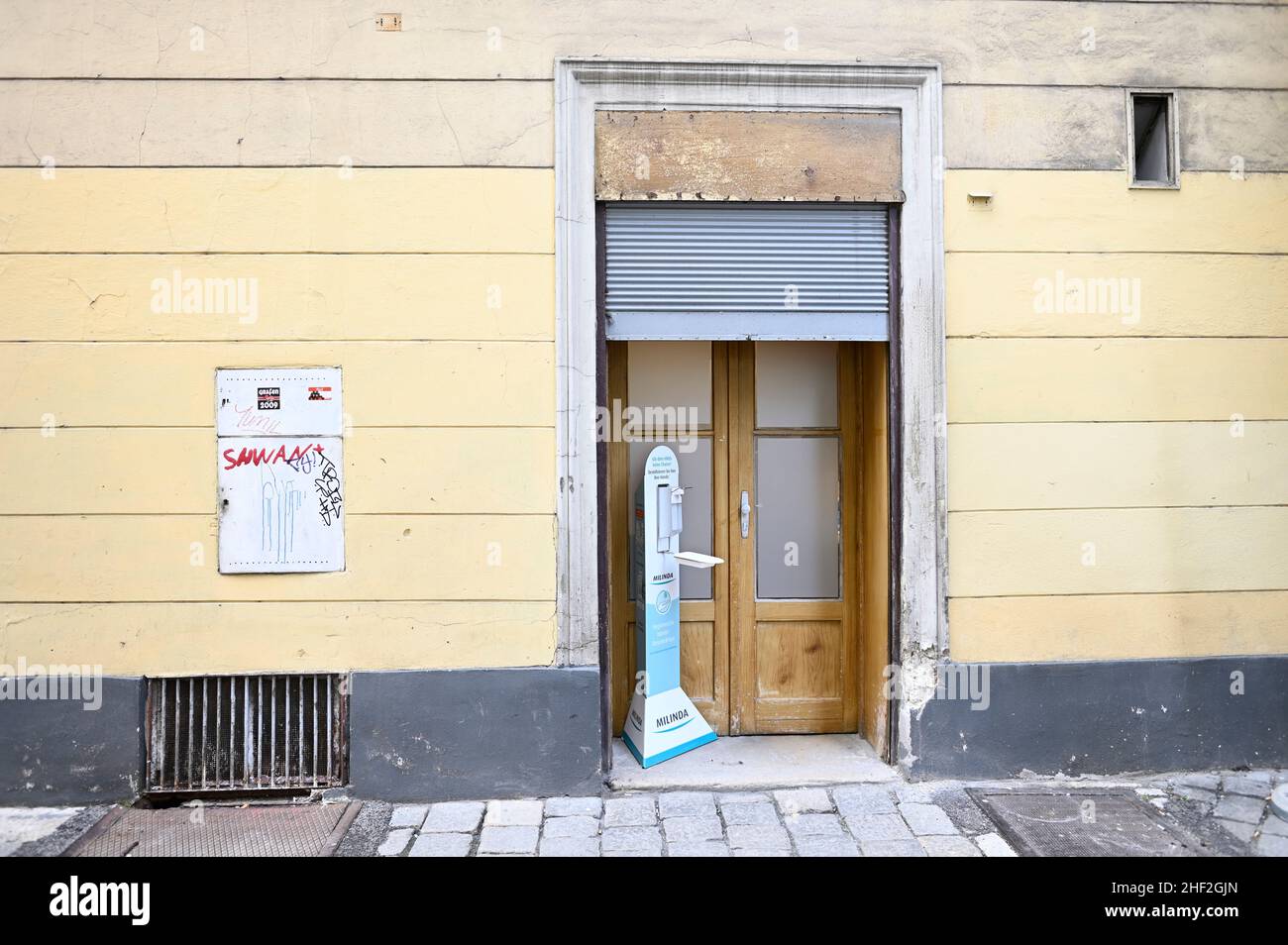Vienna, Austria. Disinfection dispenser in front of an entrance in the first district of Vienna Stock Photo