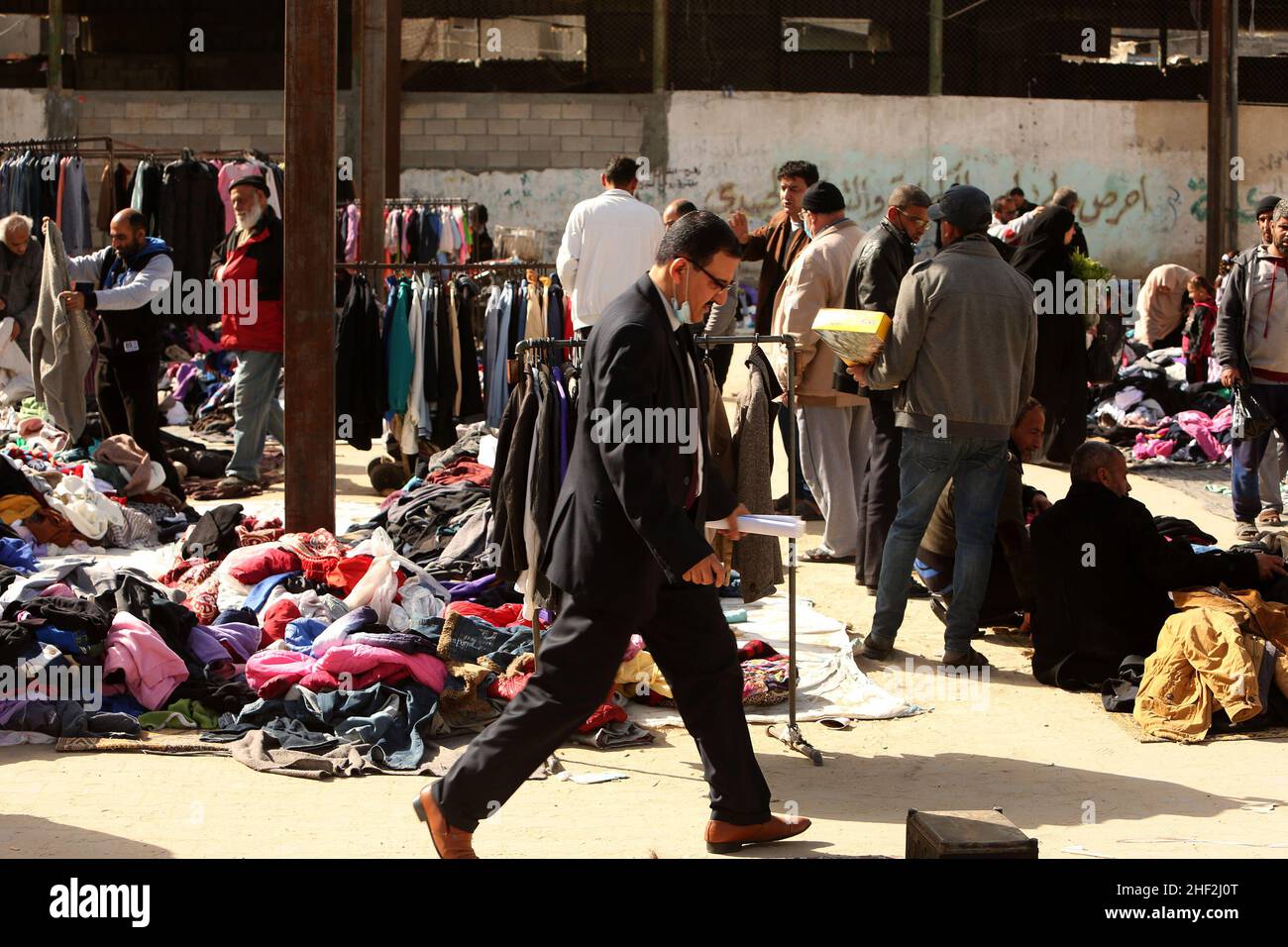 Palestinians shop at a second-hand market due to the high incidence of poverty and unemployment in Rafah, in the southern Gaza strip, on Jan 13, 2022. Stock Photo