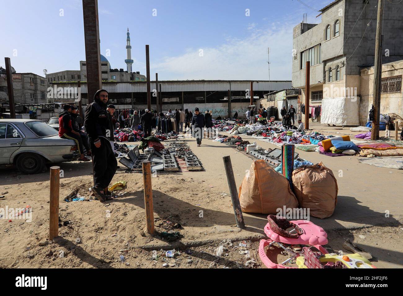Palestinians shop at a second-hand market due to the high incidence of poverty and unemployment in Rafah, in the southern Gaza strip, on Jan 13, 2022. Stock Photo