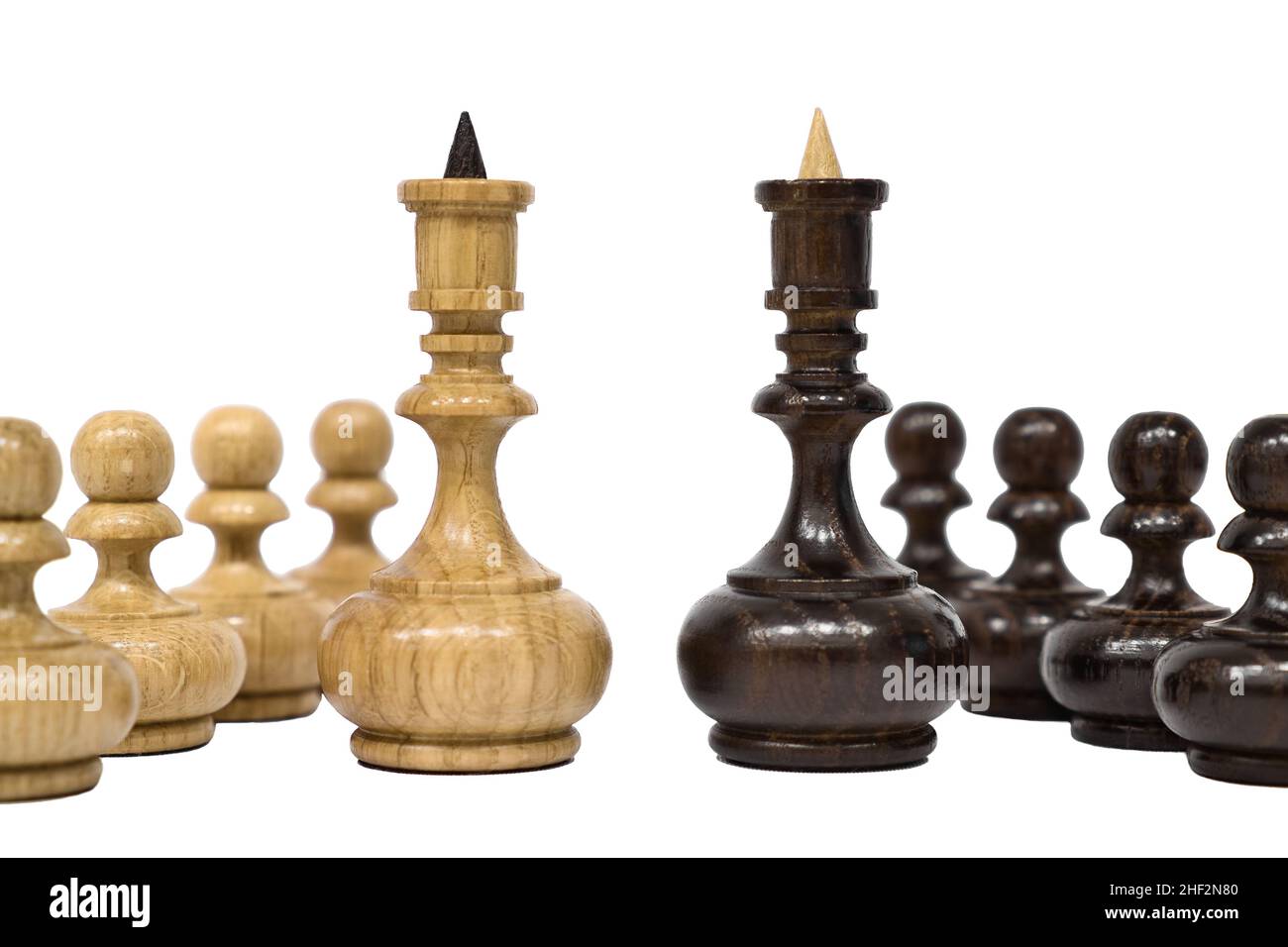 Chess pieces isolated on white background. White and black chess kings with pawns stands in front of each other. Competition and confrontation concept Stock Photo